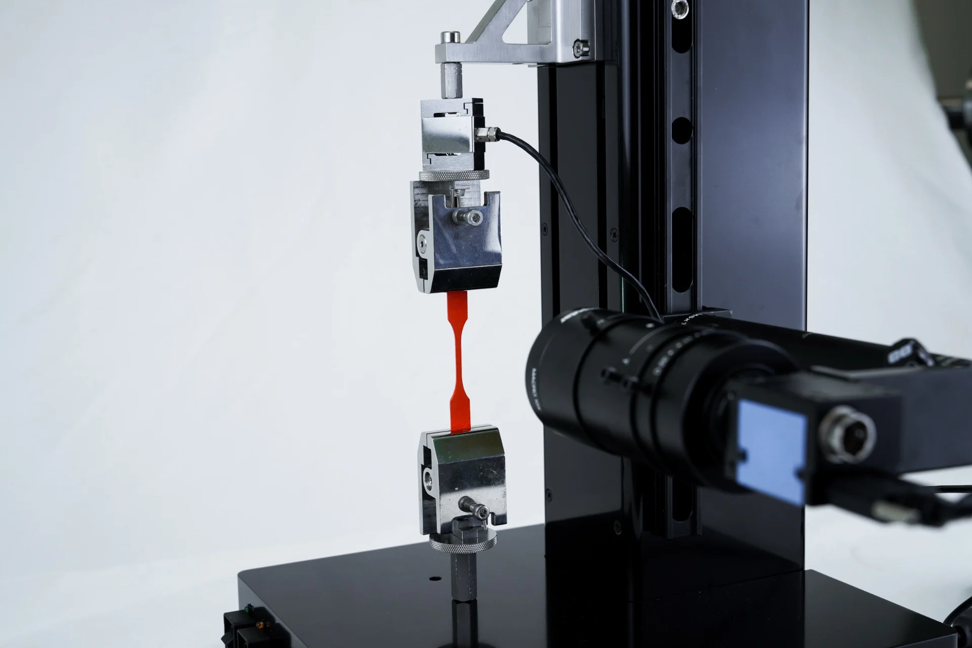 A sample being tensile tested on the UniVert mechanical tester