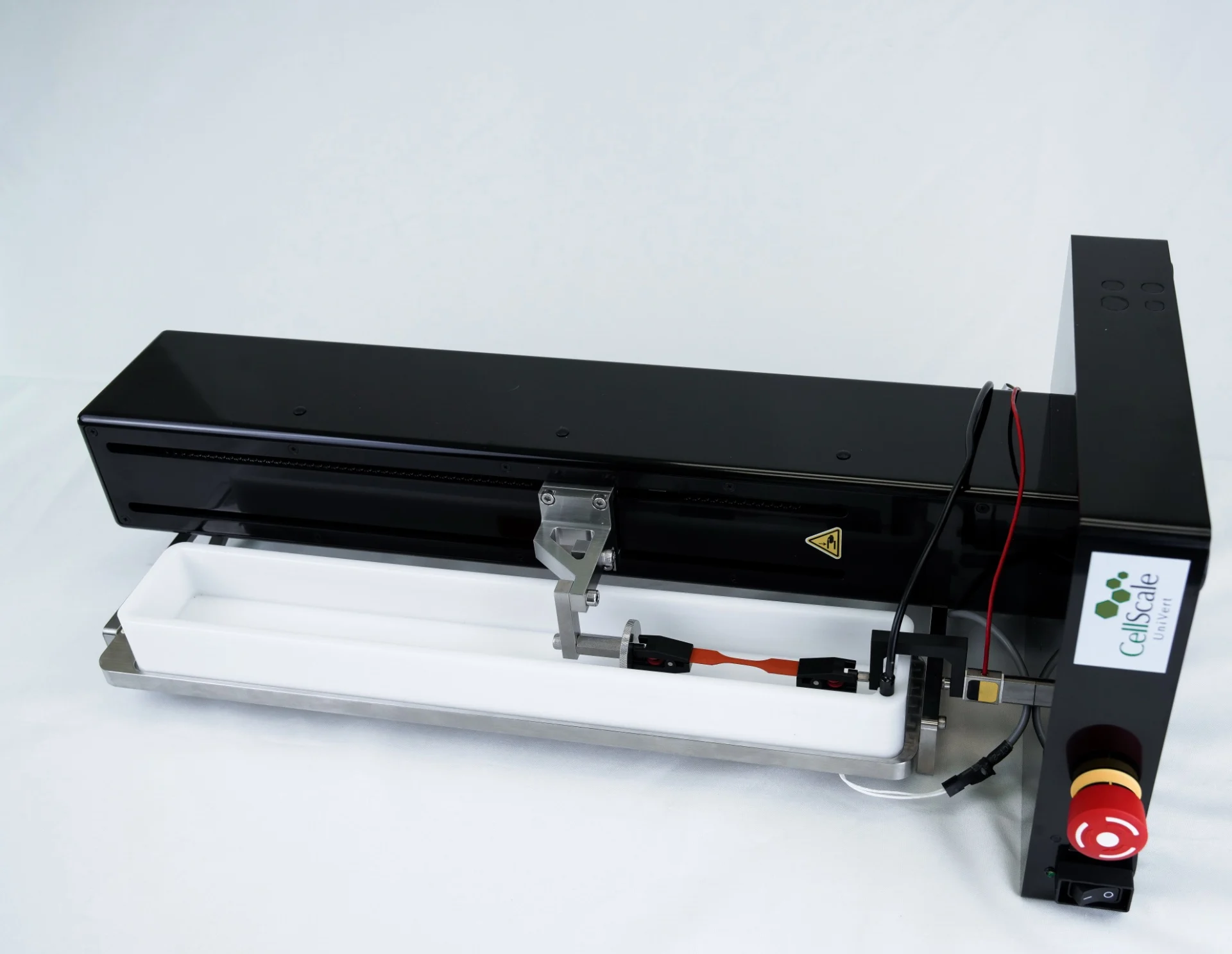 The UniVert mechanical tester in horizontal setup with a media bath and tension testing