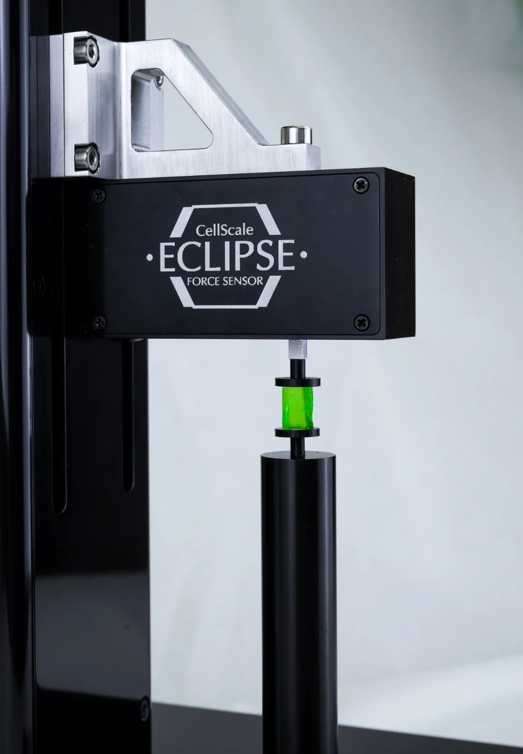 A close up of an Eclipse Ultra Low Force Sensor in compression mode with a green gel specimen mounted