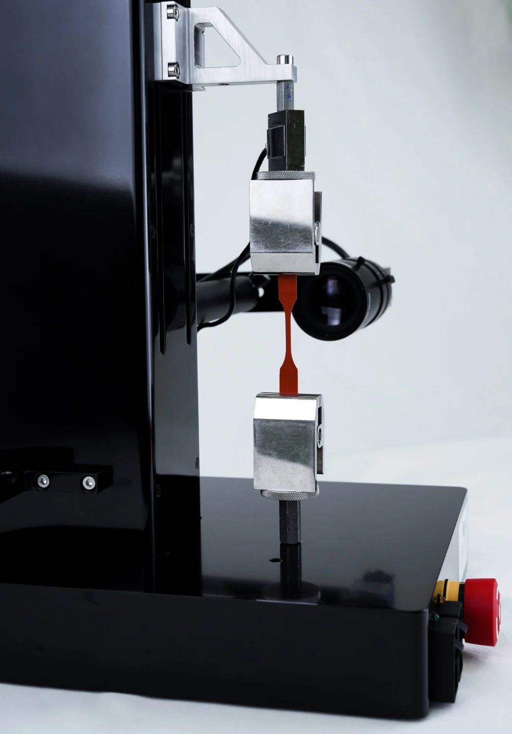 A sample being tensile tested on the UniVert with the Scientific Camera setup