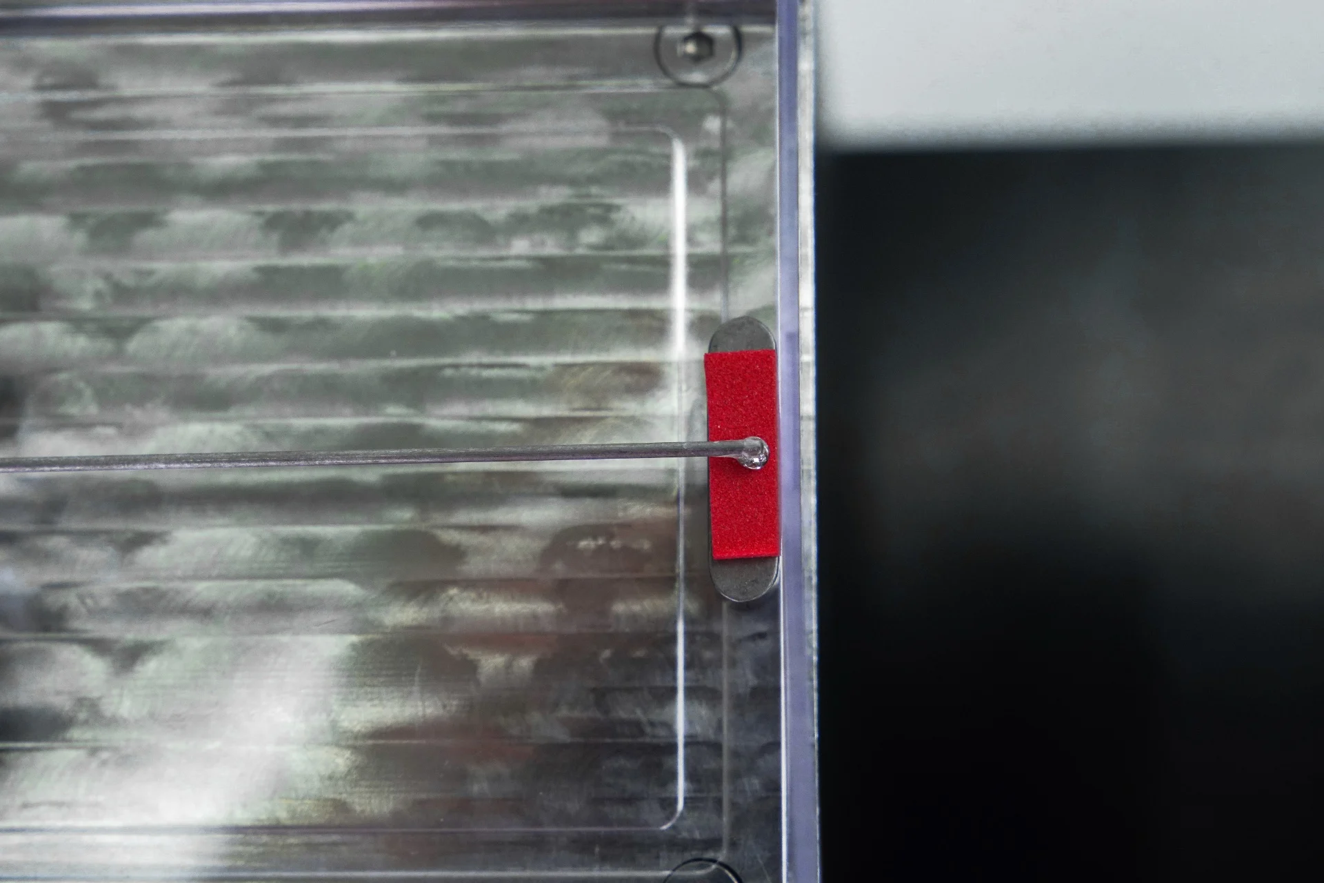 A closeup of a sample being indentation tested on the MicroTester