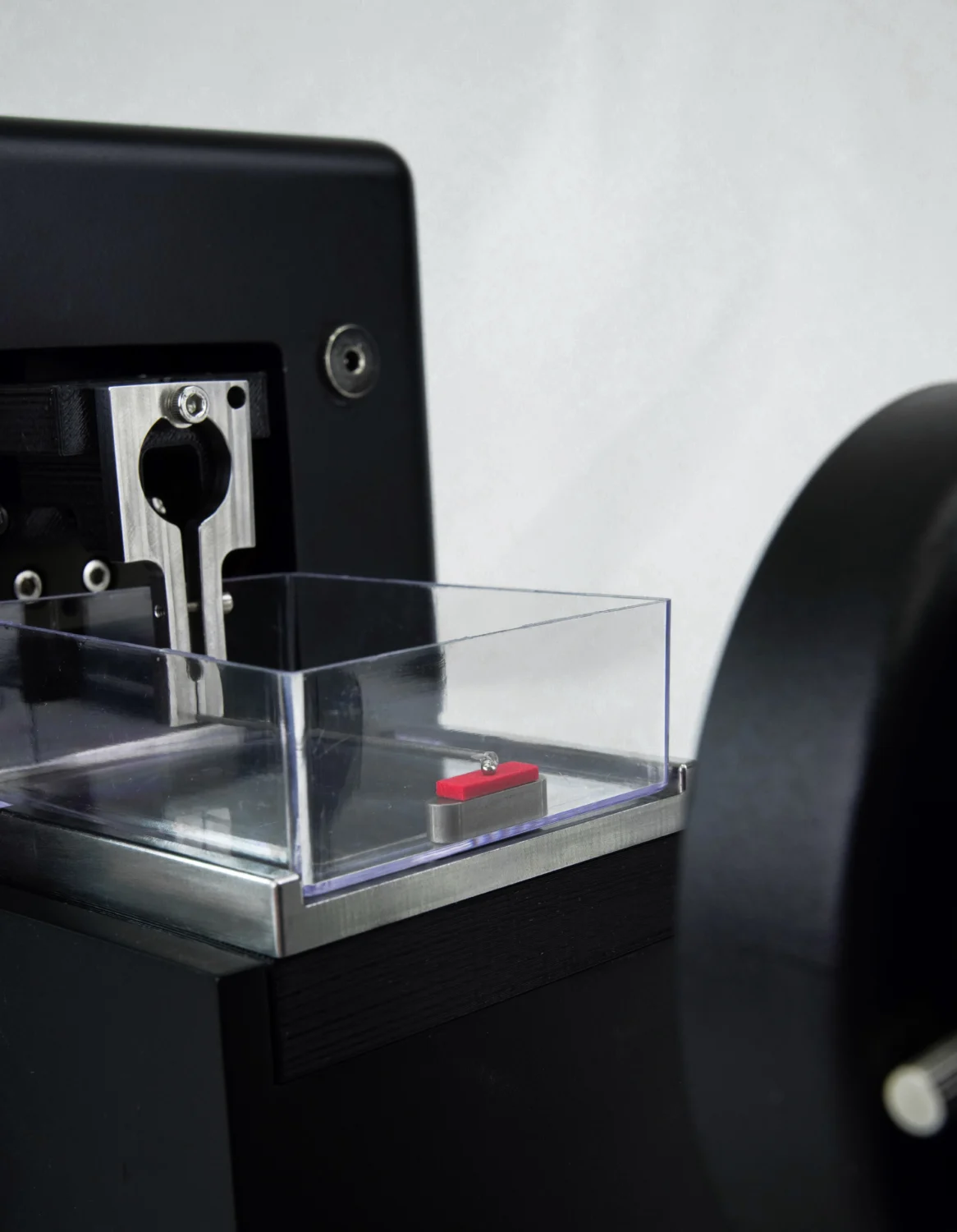 The MicroTester with a biomaterials mechanical testing sample being spherically indented, close up