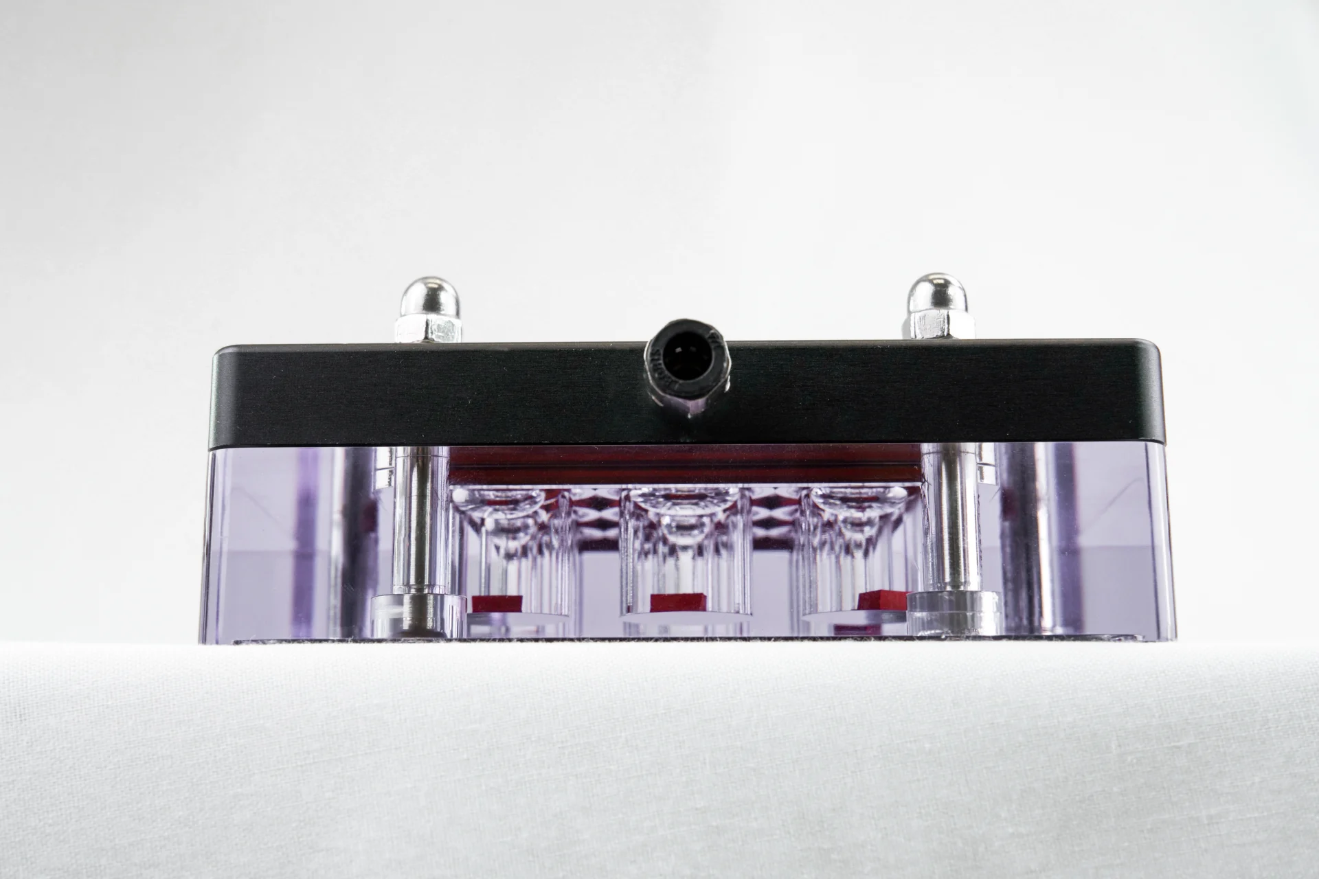 A side view of the MCTR mechanical stimulation bioreactor, highlighting the 9 wells