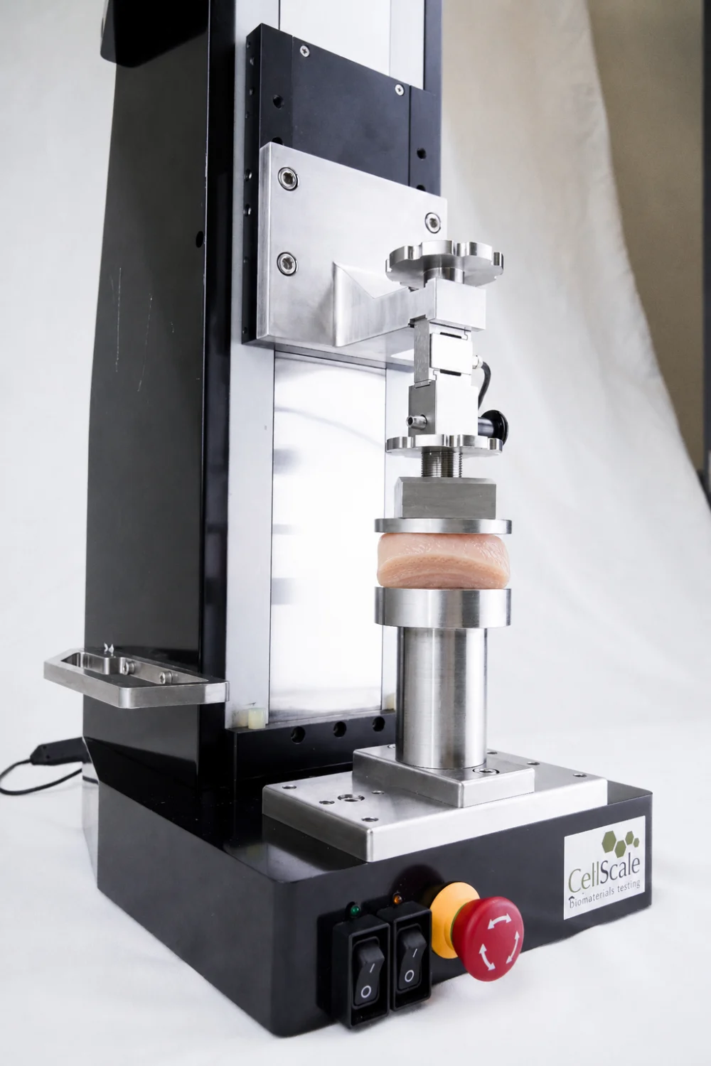 A bladder tissue specimen being compressed on the UniVert 1kN for gastrointestinal biomechanics research