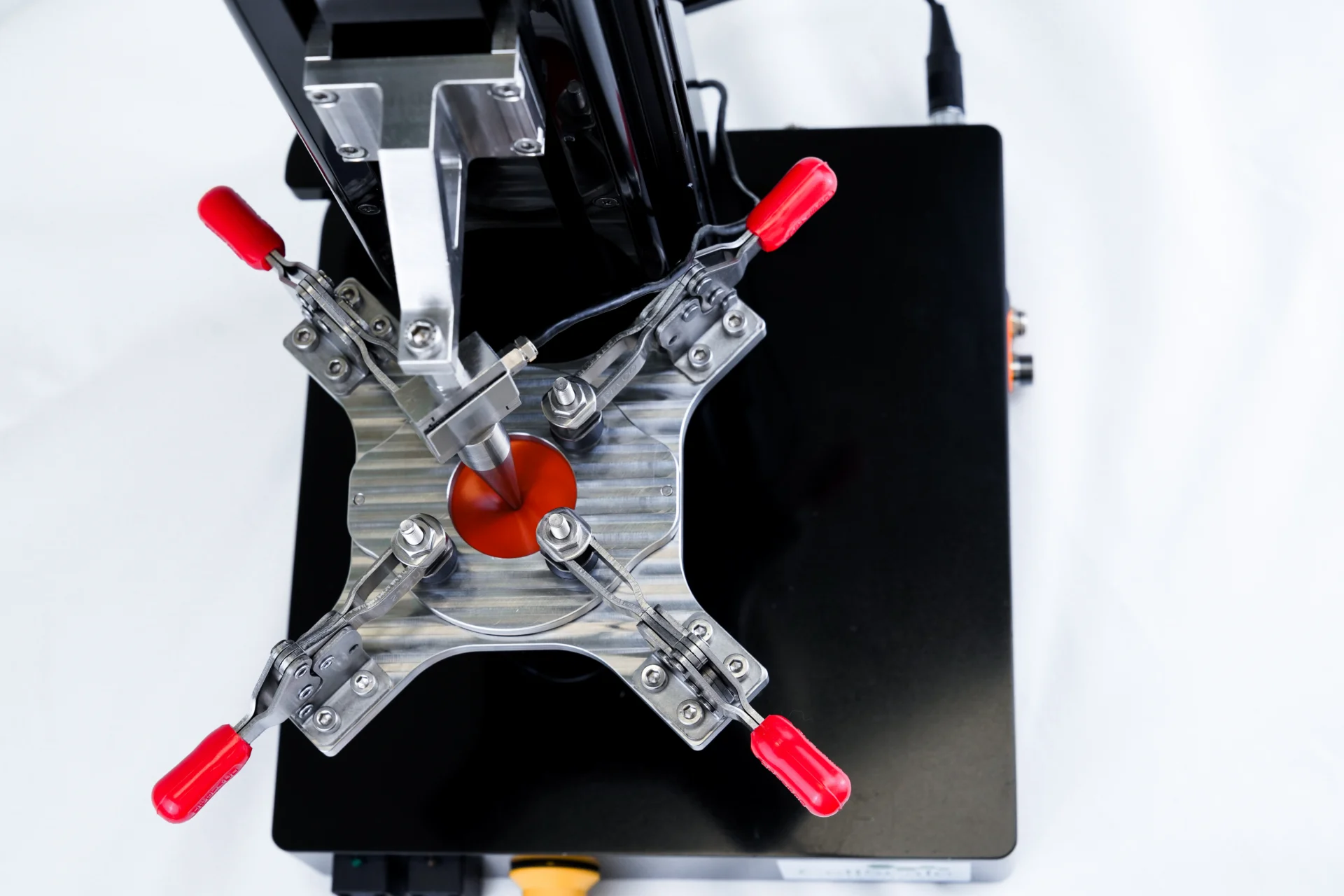 A puncture test on a thin membrane for thin film mechanical testing