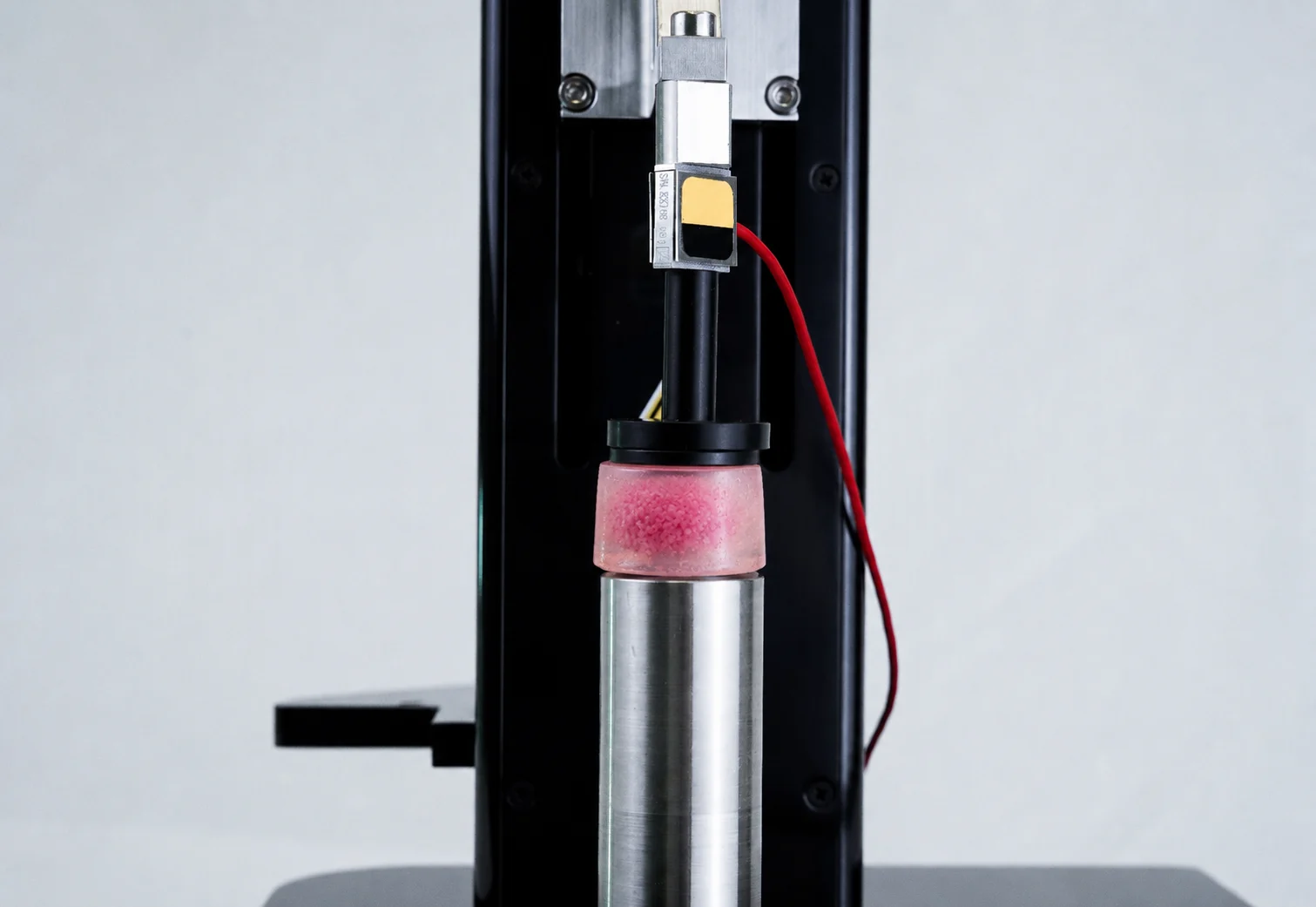 A drug-treated hydrogel microtissue sample being compression tested on the UniVert for drug screening biomechanics research